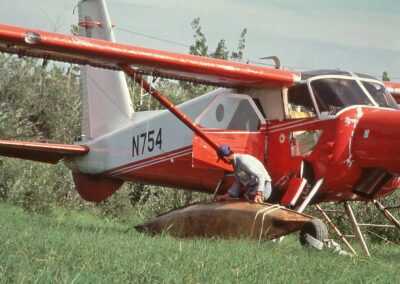 Bruce Conant loading ‘rat canoe’, used for duck brood surveys, onto N754, Yukon Flats, circa early 1980s. Photo: USFWS