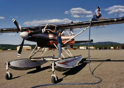 Debbie Groves (left) and Bruce Conant (on top of wing) refueling N754. Photo: USFWS