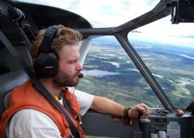 Ed Mallek piloting N754 over interior Alaska. Photo: USFWS