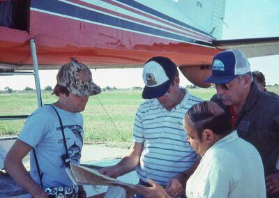 N754 on Mexico waterfowl survey, Los Mochis, 1986. Left to right:  Rodrigo Michoya, Jim Bartonek, local Mexican biologist, and Jim Voelzer. Photo: Bruce Conant