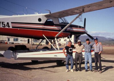 USFWS pilot-biologist Jack Hodges (2nd from left) and USFWS biologist Bill Eldridge (farthest right) with N754 in eastern Russia, celebrating the completion of their first low-level survey flight in July 1992 with their Russian partners, biologist Evgeny Syroechkovsky (farthest left) and navigator Victor Shlyaev (3rd from left). Photo: USFWS